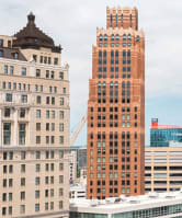 A cityscape with tall buildings and a clear sky. at The Press/321, Detroit MI