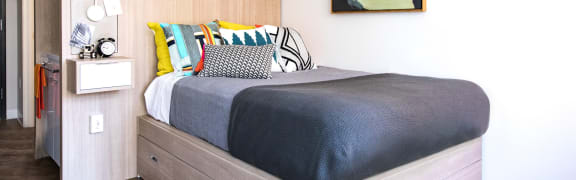 Apartment with bed at 28Grand, Detroit, 48226