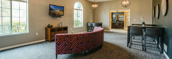 a living room with a couch and chairs