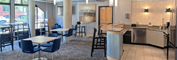 a dining room with tables and chairs in a restaurant