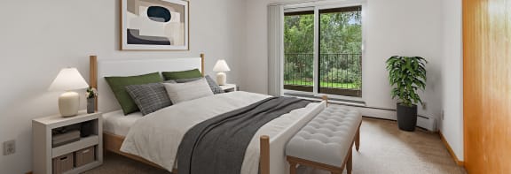 a bedroom with a bed and a large window