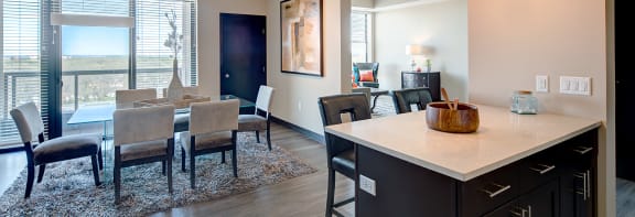 a kitchen and dining area in a 555 waverly unit