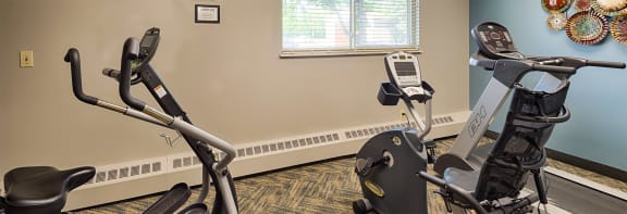 a room with two exercise bikes in it
