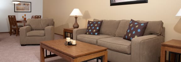 a living room with a couch and two chairs