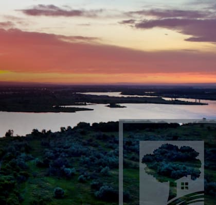 A beautiful landscape with a lake, a river and a sunset.