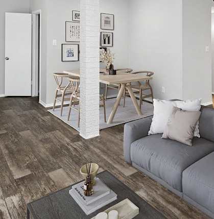 a living room with a couch and a kitchen in the background at Heatherstone, Texas, 75287