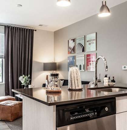 a kitchen and living room with a sink and a window at Marcato, Kansas City, Missouri