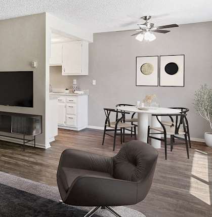 a living room with a couch and a table and a tv