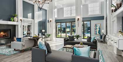 Community Clubhouse with Fireplace at Park West Apartments located in Houston, TX.