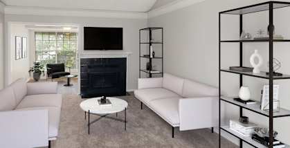Model Living Room with Carpet and Fireplace at Cobblestone Apartments in Arlington, TX-HERO.