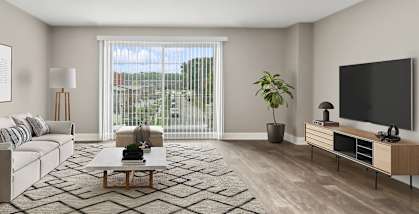 Model Living Room with Wood-Style Flooring and Patio Accessibility at Heights at Marlborough Apartments located in Marlborough, MA-HERO.