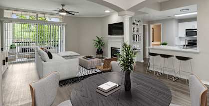 Model Dining Room with Wood-Style Flooring and View of Living Room/Kitchen Area at Allure North Dallas Apartments located in Dallas, TX-HERO.