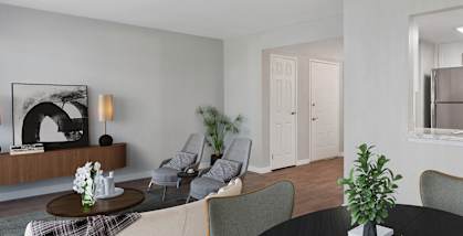 Model Living Room and Kitchen with Wood-Style Flooring at Overlook Apartments located in Salt Lake City, UT-HERO.