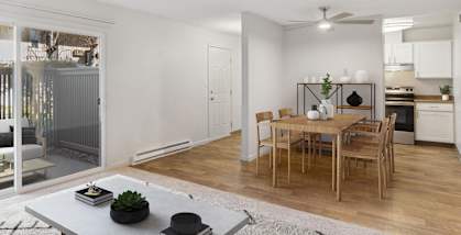 Model Living Room with Carpet and Patio Accessibility at Los Gatos Landing Apartments located in San Jose, CA-HERO.
