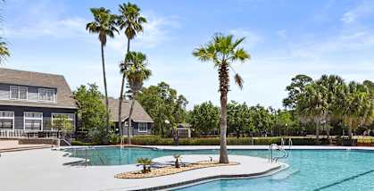 Community Swimming Pool with Pool Furniture at Mirage on Kernan Apartments located in Jacksonville, FL-HERO.