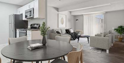 Model Dining Room with Wood-Style Flooring and View of Kitchen at Liberty Creek Apartments in Aurora, CO-HERO.