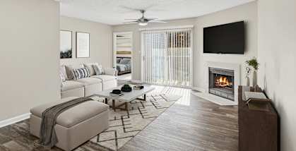 Model Living Room with Wood-Style Flooring, Fireplace and Patio Accessibility at Element 41 Apartments located in Marietta, GA-HERO.