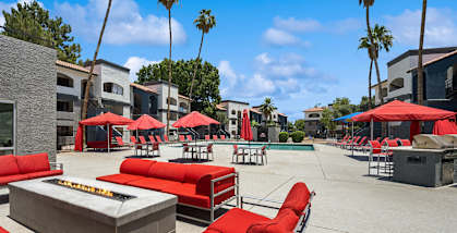 Community Fire Pit Area with Lounge Furniture at Country Club Verandas Apartments located in Mesa, AZ-HERO.