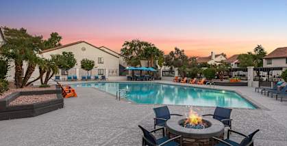 Outdoor Fire Pit Area and Swimming Pool at Lore at South Mountain Apartments located in Ahwatukee, AZ-HERO.