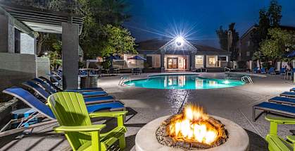 Outdoor Fire Pit Area and Swimming Pool at Array at South Mountain Apartments located in Ahwatukee, AZ-HERO.