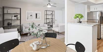 Model living room and kitchen at Haven at Water's Edge Apartments in Tampa, Florida