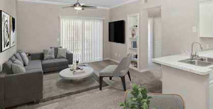 Model living room at The Belmont at Duck Creek Apartments in Garland, TX.