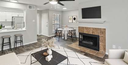 Model living room at Bridges at Deer Run Apartments in Dallas, TX.