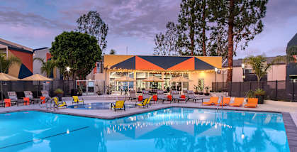 Community Swimming Pool with Pool Furniture at Horizon Apartments located in Santa Ana, CA-HERO.