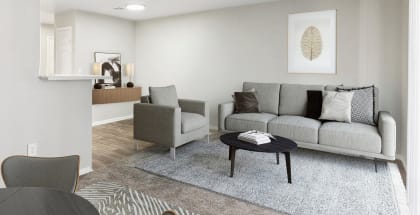Model living room with a couch and a coffee table