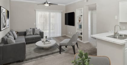 Model living room at The Belmont at Duck Creek Apartments in Garland, TX.