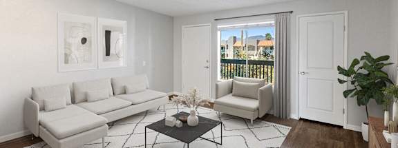 Model apartment living room with white furniture and a sliding glass door