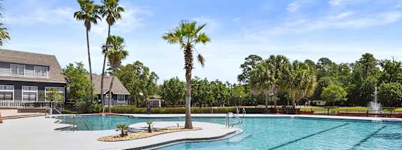 Community Swimming Pool with Pool Furniture at Mirage on Kernan Apartments located in Jacksonville, FL-HERO.