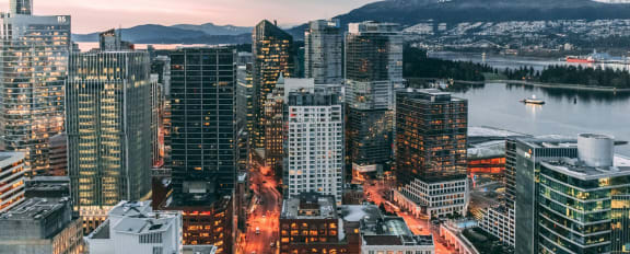 a view of the vancouver city skyline at dusk
