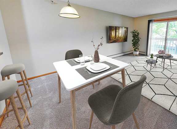 a living room with a table and chairs