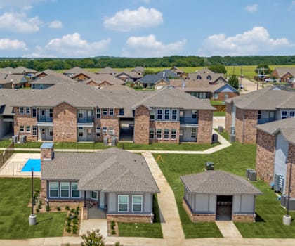 Four Cedars Apartments in Gunter, Texas Clubhouse with Pool