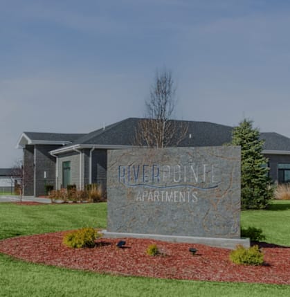 A sign in front of a building that says "Powerline Apartments".