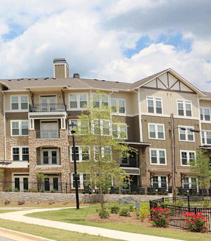 an apartment building on the corner of a street