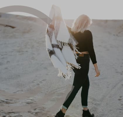 Woman Walking in Desert Holding Scarf at Lyric Apartments, Nevada