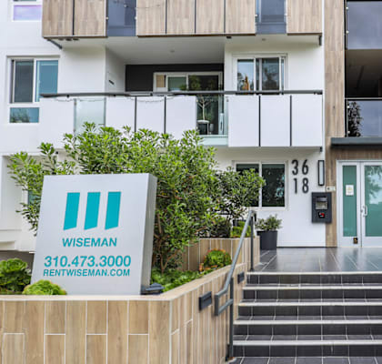 a picture of an apartment building with a sign that reads western solar