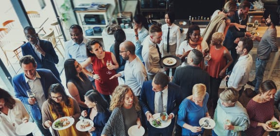 a group of people eating and drinking at a restaurant at The Met at Metro Centre Apartments, Maryland, 21117
