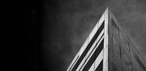 a black and white photo of a tall building
