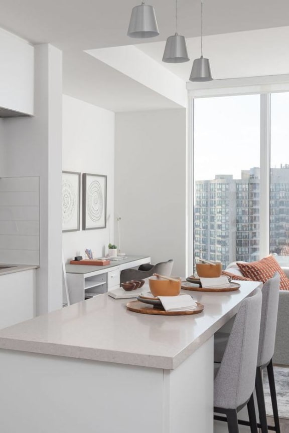 a kitchen and dining area with a large window