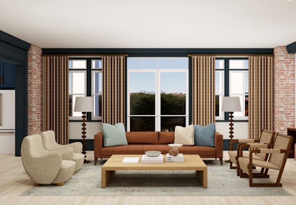 A living room with a brown sofa, two chairs, and a coffee table.