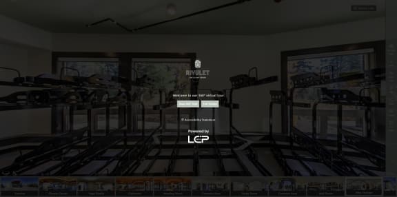 a screenshot of a gym room with weights and a scoreboard