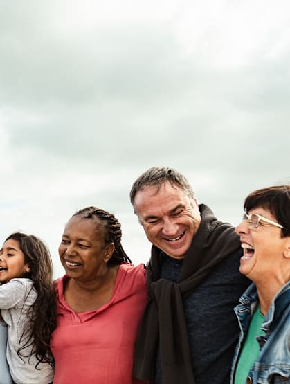 A group of people standing together outdoors.