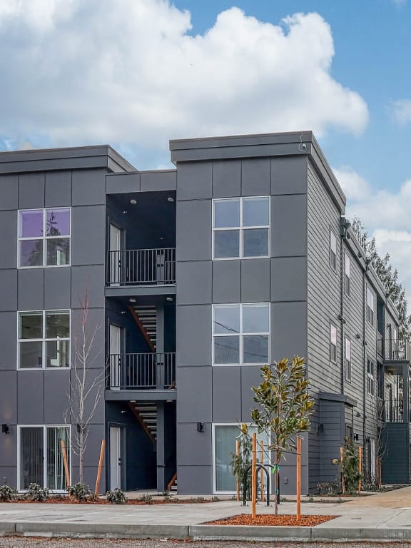 a row of apartment buildings on a city street