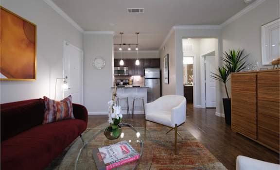 spacious open-concept apartment with hardwood-inspired flooring at Park at Magnolia apartments