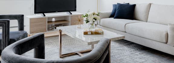 a living room with a couch and two chairs  at Chestnut Hill Village, Philadelphia, PA