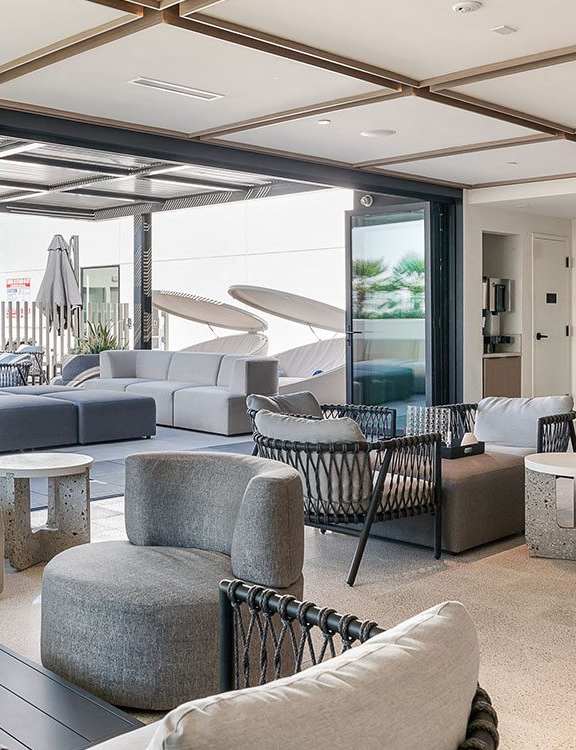 a rendering of a living room with couches and tables