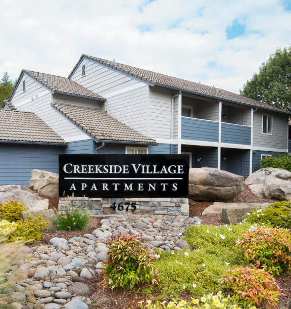 Creekside Village apartments property entrance monument sign 